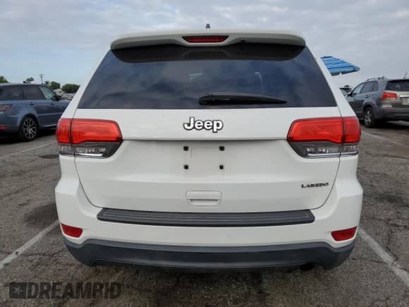 2014 Jeep Grand Cherokee Laredo with VIN 1C4RJEAG4EC265653, listed as a Copart auction lot 84594325 with Not provided miles and Salvage title. Bid and sale history available at DreamBid. Image 6.