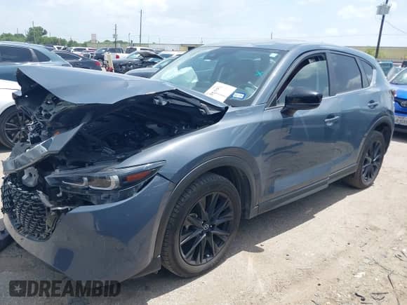 2022 Mazda CX-5 S Carbon Edition z VIN JM3KFBCM2N0571117, wystawiony jako IAAI lot #42535593 z przebiegiem 33 735 mil mil oraz . Historia ofert i sprzedaży dostępna na DreamBid. Obrazek 17.