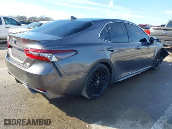 2021 Toyota Camry Hybrid XSE with VIN 4T1K31AK2MU023604, listed as a IAAI auction lot 41476057 with 26,211 mi miles and . Bid and sale history available at DreamBid. Image 4.