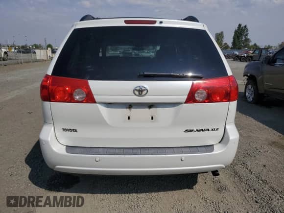 2010 Toyota Sienna XLE с VIN 5TDYK4CC2AS312328, выставлен на аукционе Copart как лот 71203025 с пробегом 182 360 миль миль и Списание • Salvage title. История ставок и продаж доступна на DreamBid. Изображение 6.