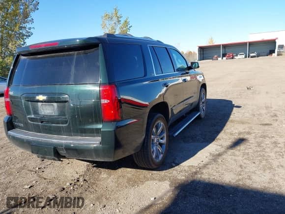 2016 Chevrolet Tahoe LTZ with VIN 1GNSKCKC7GR356857, listed as a IAAI auction lot 43515148 with 159,145 mi miles and . Bid and sale history available at DreamBid. Image 4.