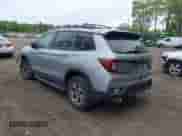 2023 Honda Passport TrailSport z VIN 5FNYF8H66PB024923, wystawiony jako IAAI lot #42243780 z przebiegiem 14 358 mil mil oraz . Historia ofert i sprzedaży dostępna na DreamBid. Obrazek 3.