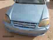 2005 Hyundai Accent GLS z VIN KMHCG35C35U361960, wystawiony jako IAAI lot #43243568 z przebiegiem 163 217 mil mil oraz . Historia ofert i sprzedaży dostępna na DreamBid. Obrazek 6.