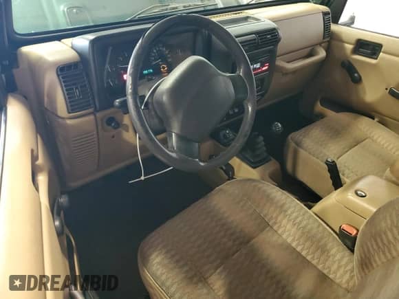 1999 Jeep Wrangler Sport z VIN 1J4FY19S6XP489688, wystawiony jako Copart lot #80084565 z przebiegiem 198 175 mil mil oraz Szkoda całkowita • Salvage title. Historia ofert i sprzedaży dostępna na DreamBid. Obrazek 8.