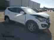 2014 Hyundai Santa Fe с VIN 5XYZU3LAXEG127728, выставлен на аукционе Copart как лот 69298855 с пробегом 98 371 миль миль и Списание • Salvage title. История ставок и продаж доступна на DreamBid. Изображение 4.