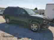 2003 Chevrolet TrailBlazer LT with VIN 1GNDT13S232405711, listed as a Copart auction lot 84405135 with 184,070 mi miles and Salvage title. Bid and sale history available at DreamBid. Image 4.