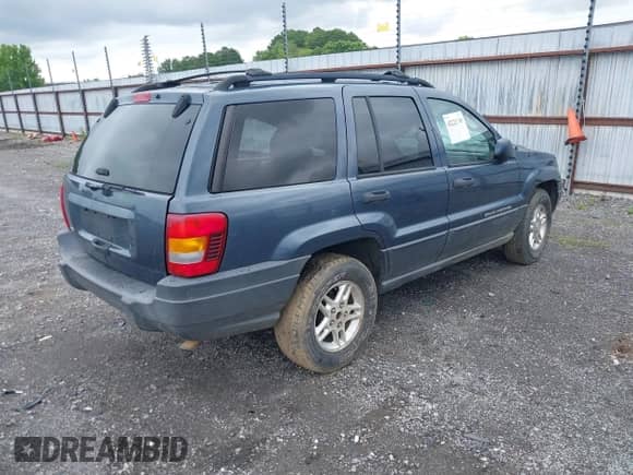 2004 Jeep Grand Cherokee Laredo with VIN 1J4GX48S34C213420, listed as a IAAI auction lot 42221769 with 194,163 mi miles and . Bid and sale history available at DreamBid. Image 4.
