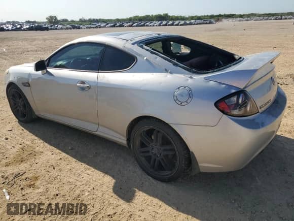 2008 Hyundai Tiburon GT с VIN KMHHN66F28U293287, выставлен на аукционе Copart как лот 52166005 с пробегом 106 072 миль миль и Чистый • Clean title. История ставок и продаж доступна на DreamBid. Изображение 2.