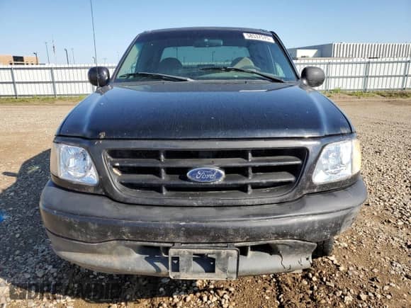 2000 Ford F-150 XL z VIN 1FTZX1729YNA19838, wystawiony jako Copart lot #58537575 z przebiegiem 254 403 mil mil oraz Czysty tytuł • Clean title. Historia ofert i sprzedaży dostępna na DreamBid. Obrazek 5.