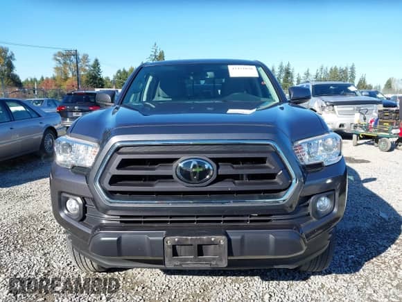 2021 Toyota Tacoma SR5 z VIN 3TMDZ5BN4MM106371, wystawiony jako IAAI lot #43451030 z przebiegiem 47 236 mil mil oraz . Historia ofert i sprzedaży dostępna na DreamBid. Obrazek 12.