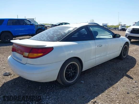1997 Saturn 2dr Coupe with VIN 1G8ZH1270VZ235219, listed as a IAAI auction lot 42229262 with 107,874 mi miles and . Bid and sale history available at DreamBid. Image 4.