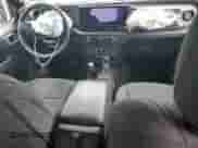 2025 Jeep Wrangler Sport S with VIN 1C4PJXDG5SW563914, listed as a Copart auction lot 67382845 with 2,810 mi miles and Salvage title. Bid and sale history available at DreamBid. Image 8.