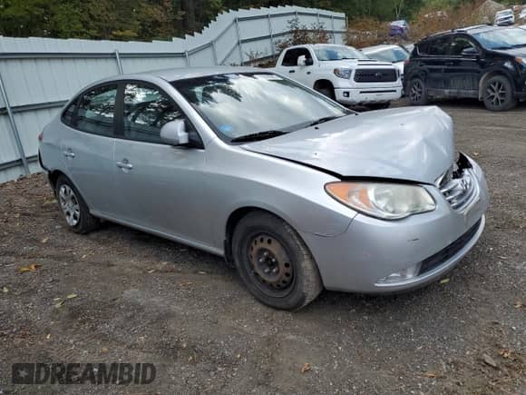2010 Hyundai Elantra Blue with VIN KMHDU4AD0AU085216, listed as a Copart auction lot 71018205 with 169,575 mi miles and Salvage title. Bid and sale history available at DreamBid. Image 4.