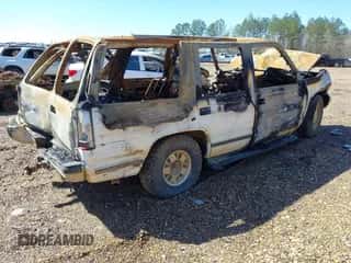 1999 Chevrolet Tahoe z VIN 1GNEC13R3XJ562550, wystawiony jako IAAI lot #41755734 z przebiegiem Nie podano mil oraz . Historia ofert i sprzedaży dostępna na DreamBid. Obrazek 4.