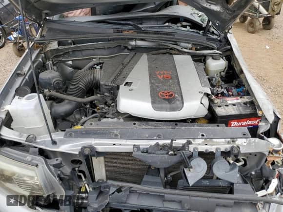 2015 Toyota Tacoma z VIN 3TMLU4EN4FM202648, wystawiony jako Copart lot #66103725 z przebiegiem 147 994 mil mil oraz Szkoda całkowita • Salvage title. Historia ofert i sprzedaży dostępna na DreamBid. Obrazek 11.