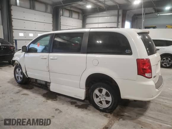 2013 Dodge Grand Caravan SXT with VIN 2C4RDGCG9DR575478, listed as a Copart auction lot 47866625 with 90,864 mi miles and Salvage title. Bid and sale history available at DreamBid. Image 2.