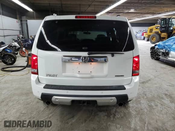 2010 Honda Pilot Touring with VIN 5FNYF3H90AB008883, listed as a Copart auction lot 58435355 with 132,020 mi miles and Salvage title. Bid and sale history available at DreamBid. Image 6.