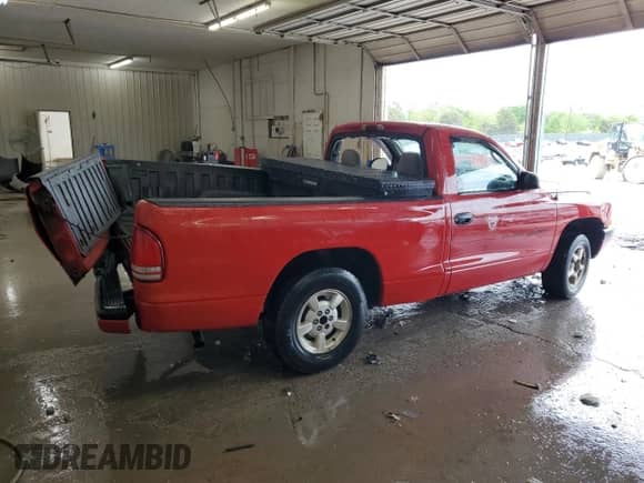 2001 Dodge Dakota z VIN 1B7FL26XX1S241586, wystawiony jako Copart lot #54127795 z przebiegiem 334 286 mil mil oraz Szkoda całkowita • Salvage title. Historia ofert i sprzedaży dostępna na DreamBid. Obrazek 3.
