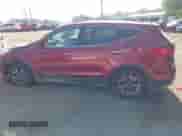 2015 Hyundai Santa Fe z VIN 5XYZTDLB4FG277210, wystawiony jako IAAI lot #43212081 z przebiegiem 218 892 mil mil oraz . Historia ofert i sprzedaży dostępna na DreamBid. Obrazek 14.