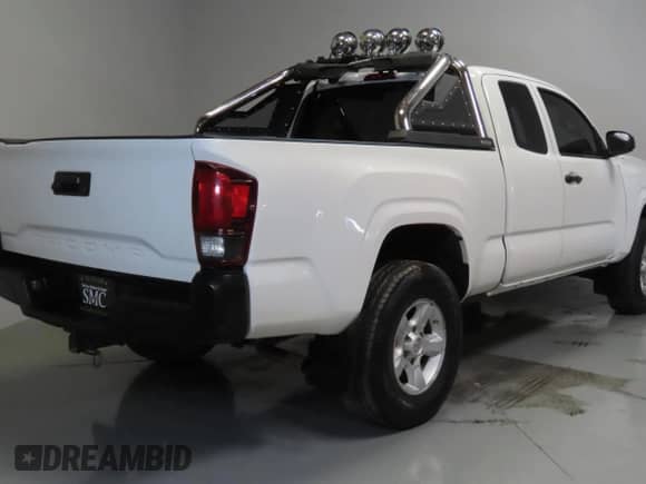 2023 Toyota Tacoma SR z VIN 3TYRX5GN5PT084863, wystawiony jako Copart lot #66671105 z przebiegiem 69 999 mil mil oraz Czysty tytuł • Clean title. Historia ofert i sprzedaży dostępna na DreamBid. Obrazek 3.