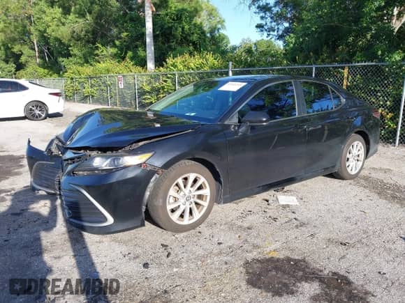 2021 Toyota Camry LE with VIN 4T1C11AK2MU472694, listed as a IAAI auction lot 43340745 with 61,965 mi miles and . Bid and sale history available at DreamBid. Image 17.