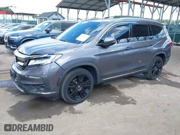 2019 Honda Pilot Touring 8-Passenger z VIN 5FNYF6H9XKB002530, wystawiony jako IAAI lot #43112644 z przebiegiem 122 140 mil mil oraz . Historia ofert i sprzedaży dostępna na DreamBid. Obrazek 2.