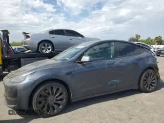 2023 Tesla Model Y Performance z VIN 7SAYGDEFXPF582397, wystawiony jako Copart lot #81773635 z przebiegiem 52 262 mil mil oraz Szkoda całkowita • Salvage title. Historia ofert i sprzedaży dostępna na DreamBid. Obrazek 1.