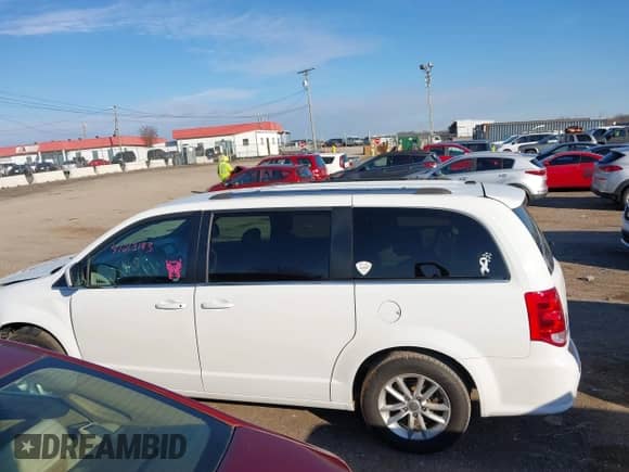 2019 Dodge Grand Caravan SXT with VIN 2C4RDGCG1KR672042, listed as a IAAI auction lot 41213183 with 160,019 mi miles and . Bid and sale history available at DreamBid. Image 14.