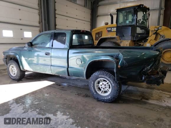 1999 Dodge Dakota SLT z VIN 1B7GG22Y9XS149398, wystawiony jako Copart lot #47950025 z przebiegiem 173 413 mil mil oraz Szkoda całkowita • Salvage title. Historia ofert i sprzedaży dostępna na DreamBid. Obrazek 2.