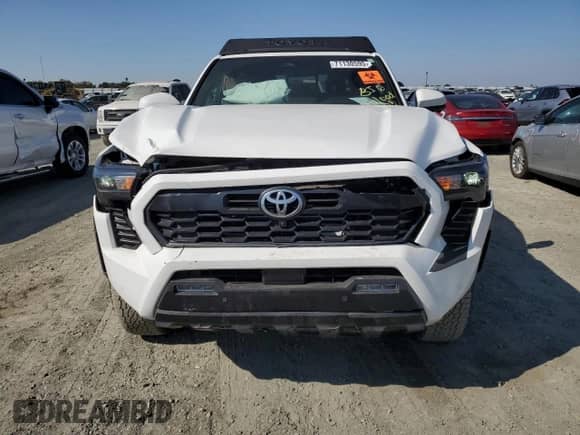 2024 Toyota Tacoma SR5 with VIN 3TMLB5JN4RM050957, listed as a Copart auction lot 71130595 with 1,873 mi miles and Salvage title. Bid and sale history available at DreamBid. Image 5.