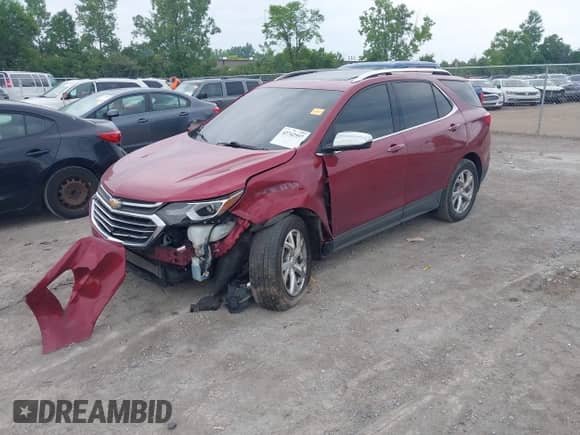 2020 Chevrolet Equinox Premier z VIN 2GNAXXEV0L6176692, wystawiony jako IAAI lot #42742557 z przebiegiem 63 026 mil mil oraz . Historia ofert i sprzedaży dostępna na DreamBid. Obrazek 2.