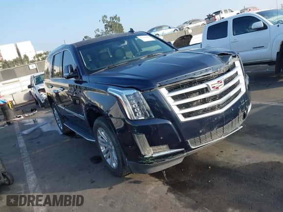 2018 Cadillac Escalade z VIN 1GYS3AKJXJR126577, wystawiony jako IAAI lot #41225966 z przebiegiem 69 845 mil mil oraz . Historia ofert i sprzedaży dostępna na DreamBid. Obrazek 1.