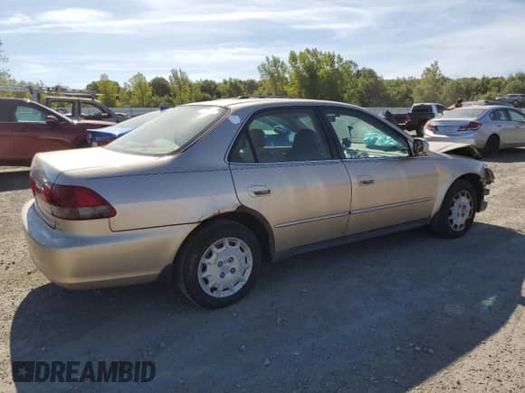 2002 Honda Accord LX with VIN 1HGCG66532A017047, listed as a Copart auction lot 70463135 with 212,898 mi miles and Clean title. Bid and sale history available at DreamBid. Image 3.