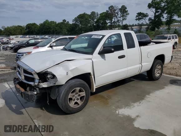 2006 Dodge Dakota SLT с VIN 1D7HE42KX6S646479, выставлен на аукционе Copart как лот 53578495 с пробегом 254 683 миль миль и Списание • Salvage title. История ставок и продаж доступна на DreamBid. Изображение 1.