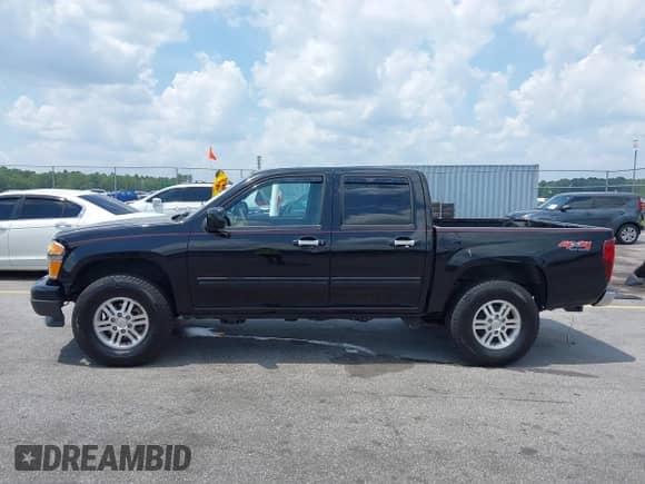 2011 Chevrolet Colorado 1LT z VIN 1GCHTCFE8B8105355, wystawiony jako IAAI lot #42298157 z przebiegiem 213 853 mil mil oraz . Historia ofert i sprzedaży dostępna na DreamBid. Obrazek 14.