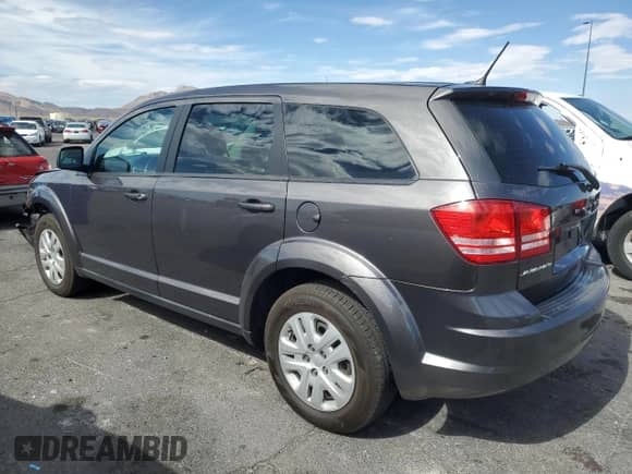 2015 Dodge Journey SE with VIN 3C4PDCAB8FT531642, listed as a Copart auction lot 69597325 with 90,030 mi miles and Salvage title. Bid and sale history available at DreamBid. Image 2.