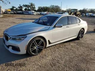 2016 BMW 7 Series 750i xDrive with VIN WBA7B0C59GG526741, listed as a Copart auction lot 86312384 with 90,360 mi miles and Salvage title. Bid and sale history available at DreamBid. Image 1.