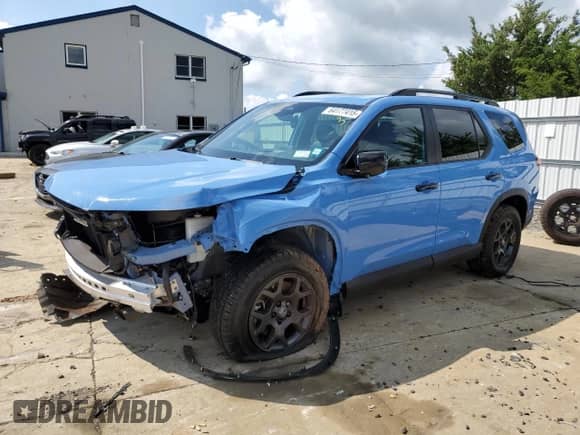 2025 Honda Pilot TrailSport with VIN 5FNYG1H60SB024414, listed as a Copart auction lot 64177415 with Not provided miles and Salvage title. Bid and sale history available at DreamBid. Image 1.
