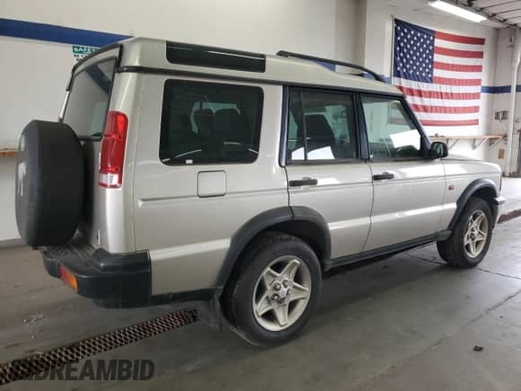 2000 Land Rover Discovery Cloth with VIN SALTY1541YA261319, listed as a Copart auction lot 86040445 with 153,917 mi miles and Clean title. Bid and sale history available at DreamBid. Image 3.