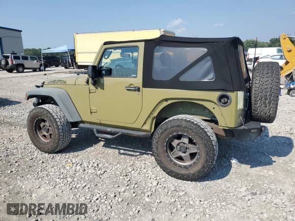 2013 Jeep Wrangler Rubicon with VIN 1C4HJWCG0DL566479, listed as a Copart auction lot 69092745 with 103,839 mi miles and Salvage title. Bid and sale history available at DreamBid. Image 2.