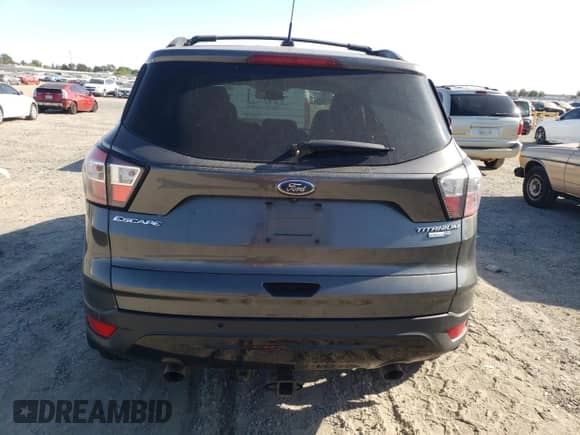 2017 Ford Escape Titanium z VIN 1FMCU9JD2HUC02846, wystawiony jako Copart lot #71730795 z przebiegiem 172 823 mil mil oraz Szkoda całkowita • Salvage title. Historia ofert i sprzedaży dostępna na DreamBid. Obrazek 6.