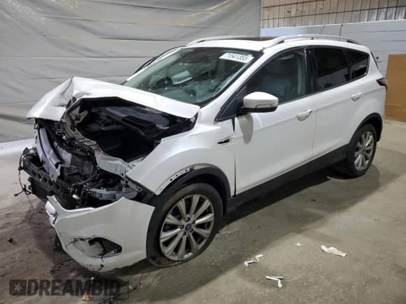 2017 Ford Escape Titanium с VIN 1FMCU9JD1HUD63642, выставлен на аукционе Copart как лот 71541355 с пробегом Не указан миль и Списание • Salvage title. История ставок и продаж доступна на DreamBid. Изображение 1.