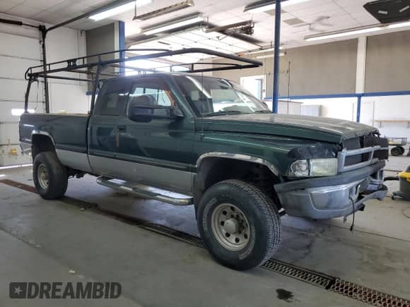 1998 Dodge 2500 with VIN 1B7KF23D9WJ116981, listed as a Copart auction lot 68971164 with 221,823 mi miles and Salvage title. Bid and sale history available at DreamBid. Image 4.