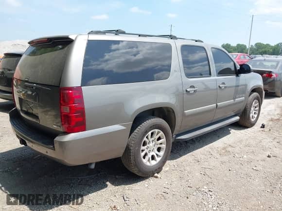 2007 Chevrolet Suburban LT with VIN 1GNFC16087J214521, listed as a IAAI auction lot 42813416 with 207,126 mi miles and . Bid and sale history available at DreamBid. Image 4.