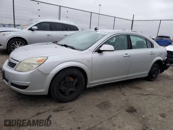 2009 Saturn Aura XE with VIN 1G8ZS57B09F158011, listed as a Copart auction lot 69934905 with 203,855 mi miles and Salvage title. Bid and sale history available at DreamBid. Image 1.