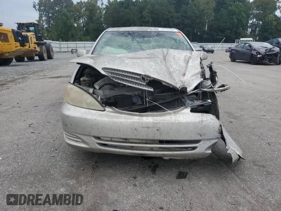 2002 Toyota Camry LE с VIN 4T1BE32K52U555219, выставлен на аукционе Copart как лот 84436005 с пробегом Не указан миль и Списание • Salvage title. История ставок и продаж доступна на DreamBid. Изображение 5.