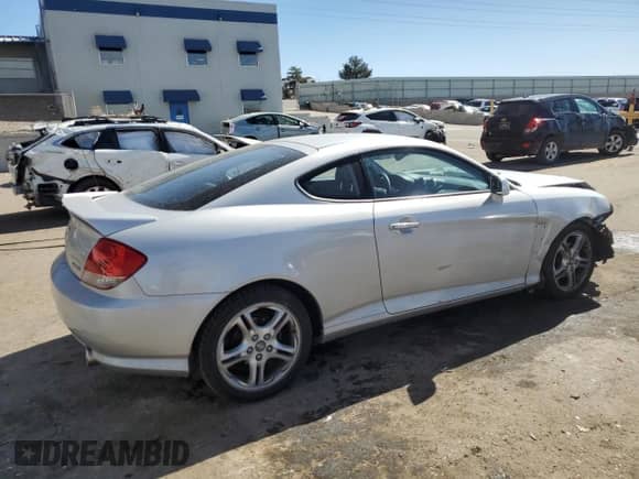 2006 Hyundai Tiburon GT z VIN KMHHN65F76U190851, wystawiony jako Copart lot #45935795 z przebiegiem 102 335 mil mil oraz Szkoda całkowita • Salvage title. Historia ofert i sprzedaży dostępna na DreamBid. Obrazek 3.