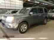 2009 Honda Pilot LX with VIN 5FNYF38219B009703, listed as a Copart auction lot 86054625 with 215,143 mi miles and Clean title. Bid and sale history available at DreamBid. Image 1.