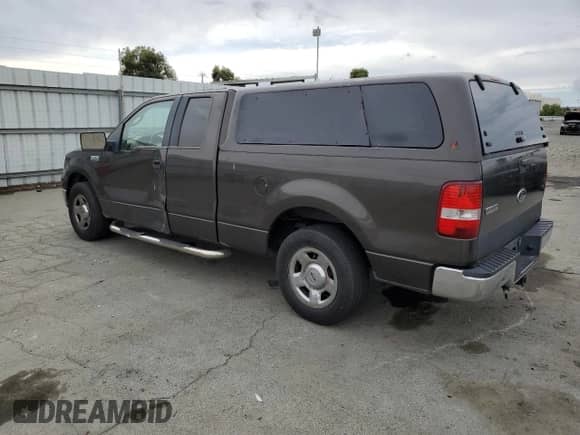 2005 Ford F-150 XLT with VIN 1FTPX12575NA85342, listed as a Copart auction lot 82204225 with 221,143 mi miles and Salvage title. Bid and sale history available at DreamBid. Image 2.
