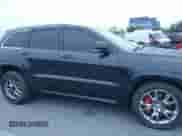 2014 Jeep Grand Cherokee SRT-8 z VIN 1C4RJFDJ9EC347505, wystawiony jako IAAI lot #41896248 z przebiegiem 59 049 mil mil oraz . Historia ofert i sprzedaży dostępna na DreamBid. Obrazek 13.
